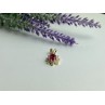 14K YELLOW GOLD RUBY & WHITE TOPAZ PENDANT